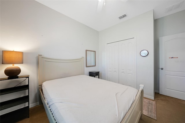 carpeted bedroom with a closet and ceiling fan