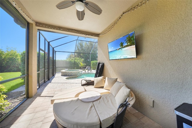 sunroom / solarium with ceiling fan