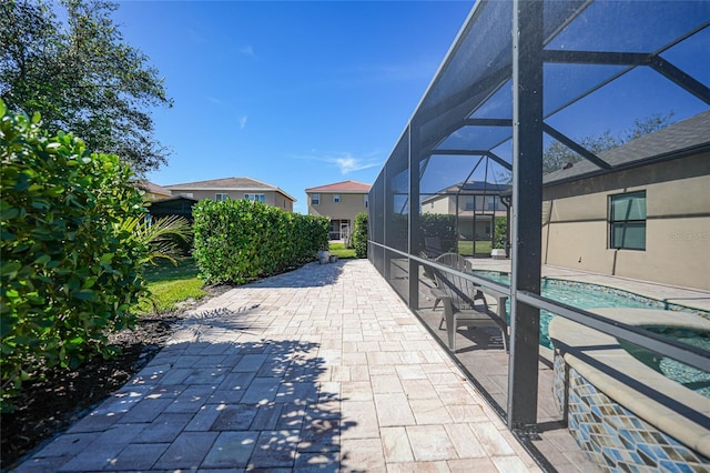 view of patio / terrace with glass enclosure