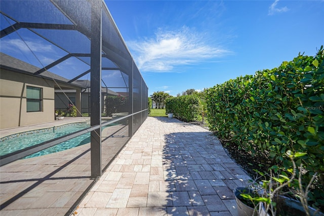 view of pool featuring a lanai and a patio area