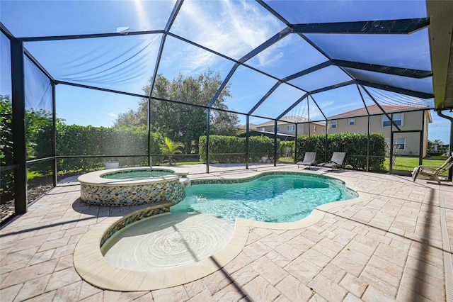 view of pool with a lanai, a patio, and an in ground hot tub