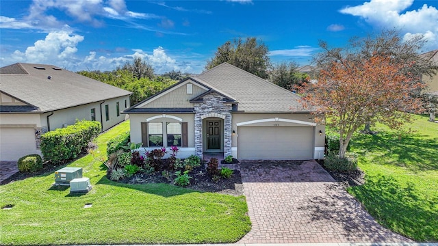 view of front of house featuring a garage and a front yard