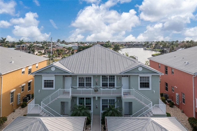 back of house featuring a water view