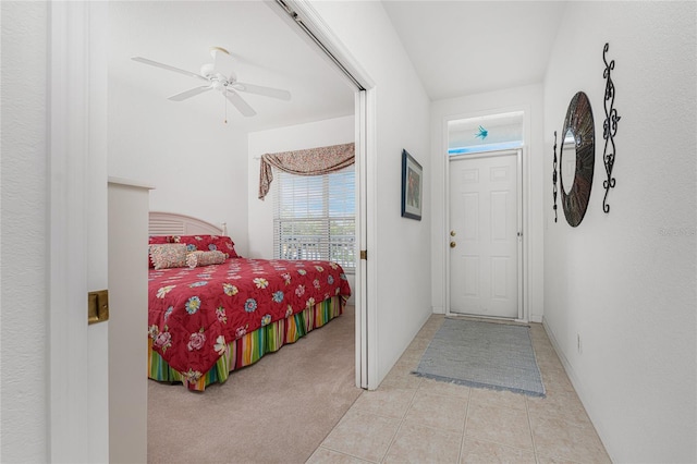 bedroom featuring ceiling fan and light colored carpet