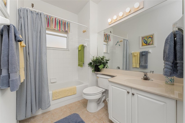 full bathroom featuring tile patterned flooring, vanity, toilet, and shower / tub combo