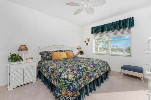 bedroom with light colored carpet and ceiling fan