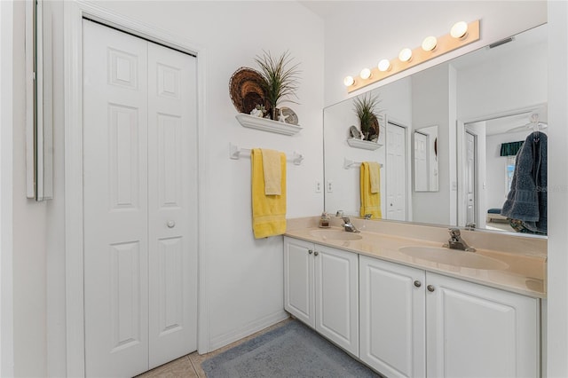 bathroom with tile patterned floors and vanity