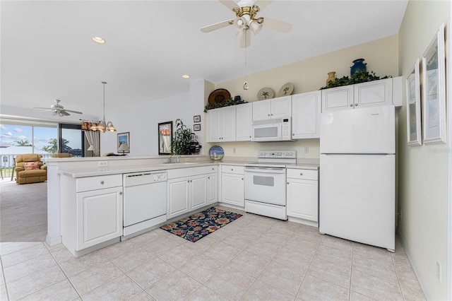 kitchen with white appliances, white cabinets, ceiling fan with notable chandelier, light tile patterned floors, and kitchen peninsula