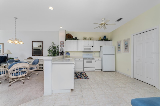 kitchen featuring kitchen peninsula, white appliances, ceiling fan with notable chandelier, decorative light fixtures, and white cabinetry