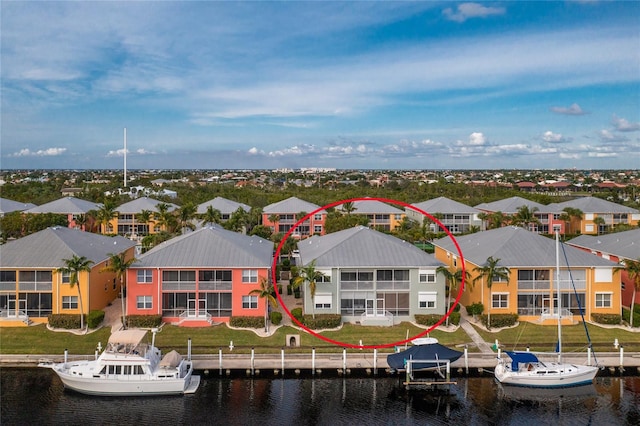 birds eye view of property featuring a water view