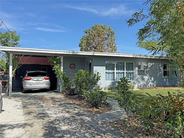 ranch-style house with a carport