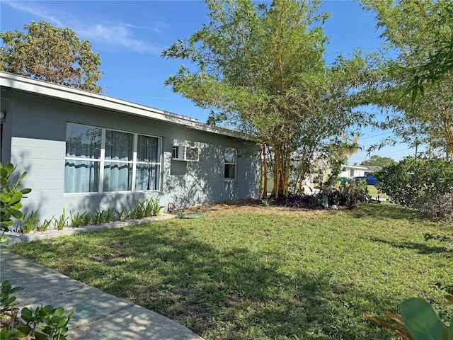 107 Dunn Dr NE, Port Charlotte, FL 33952 - view of home's exterior with a yard