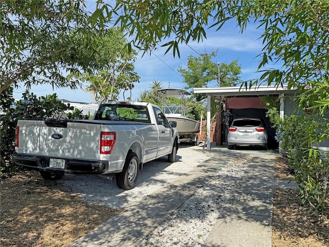 view of parking featuring a carport