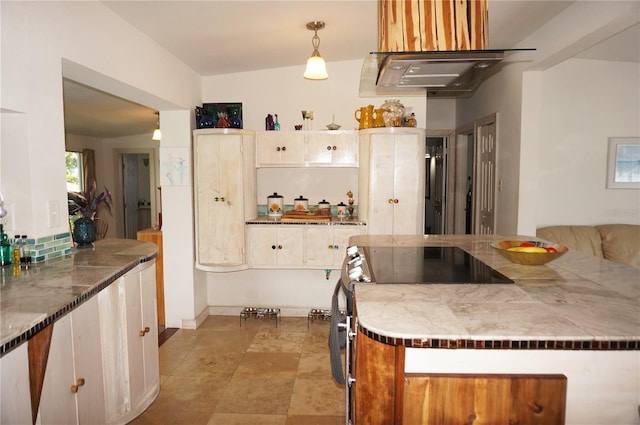 kitchen featuring range and hanging light fixtures