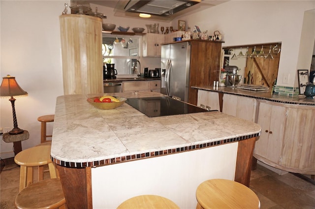 107 Dunn Dr NE, Port Charlotte, FL 33952 - kitchen with appliances with stainless steel finishes, extractor fan, open shelves, and a kitchen breakfast bar