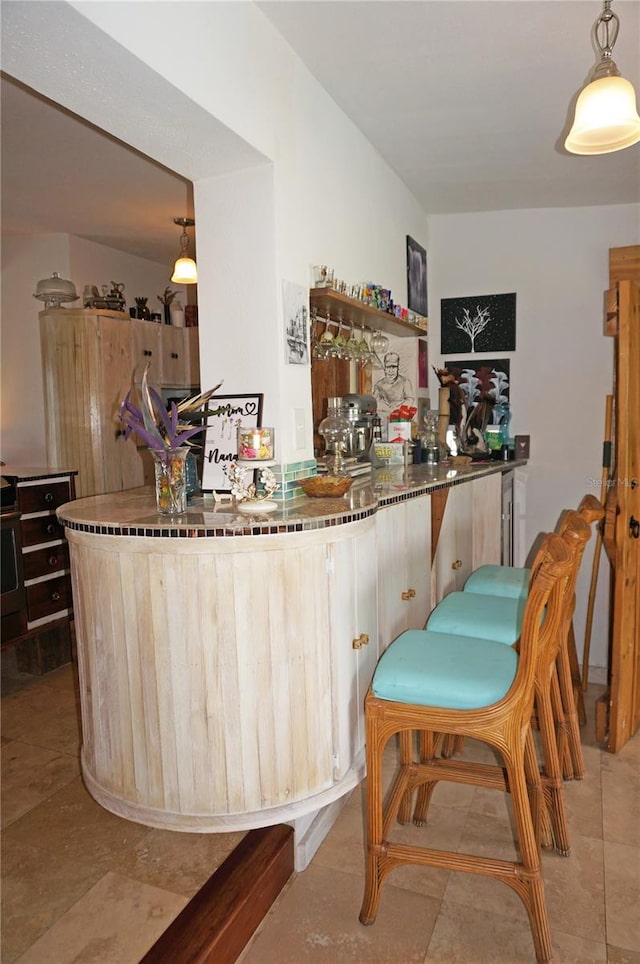 bar featuring decorative light fixtures