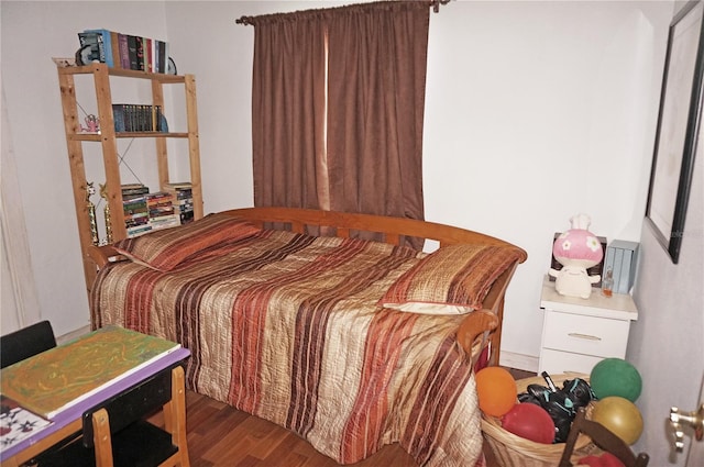 bedroom featuring dark hardwood / wood-style flooring