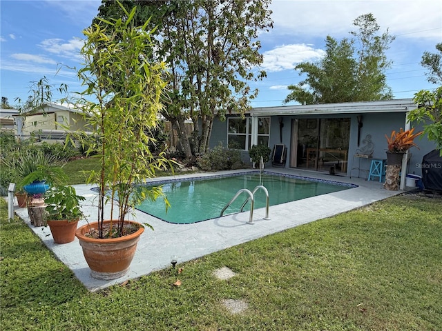 107 Dunn Dr NE, Port Charlotte, FL 33952 - outdoor pool with a yard and a patio area