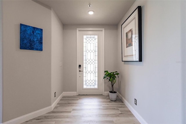 foyer entrance with light hardwood / wood-style floors