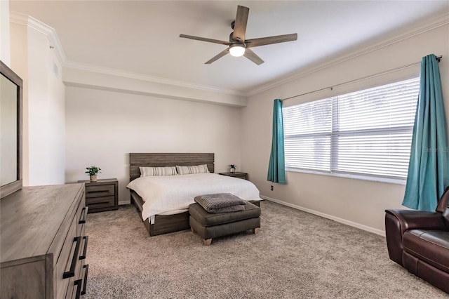 carpeted bedroom featuring ceiling fan and ornamental molding