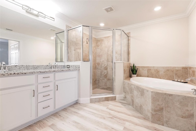 bathroom with crown molding, plus walk in shower, vanity, and hardwood / wood-style flooring