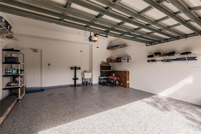 garage featuring sink and a garage door opener