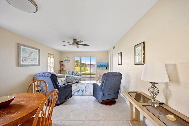 tiled living room featuring ceiling fan