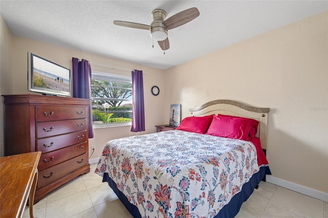 bedroom featuring ceiling fan and light tile patterned flooring