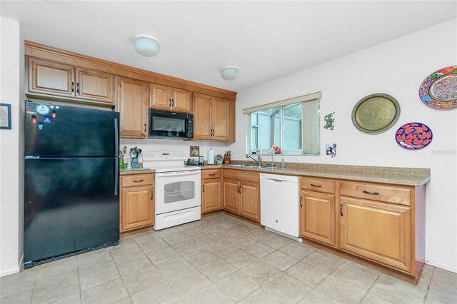 kitchen featuring light tile patterned floors and black appliances