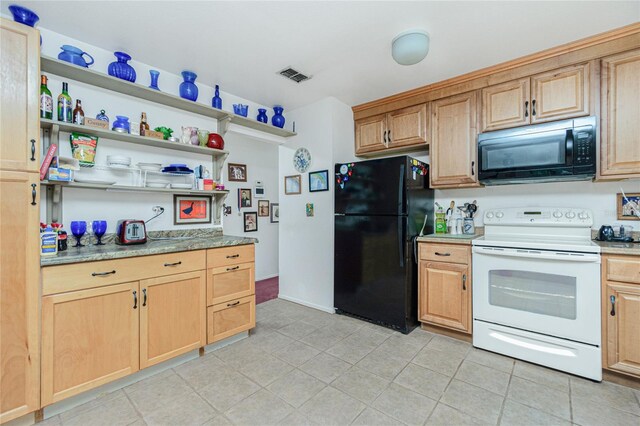 kitchen with light brown cabinetry, light tile patterned floors, and black appliances