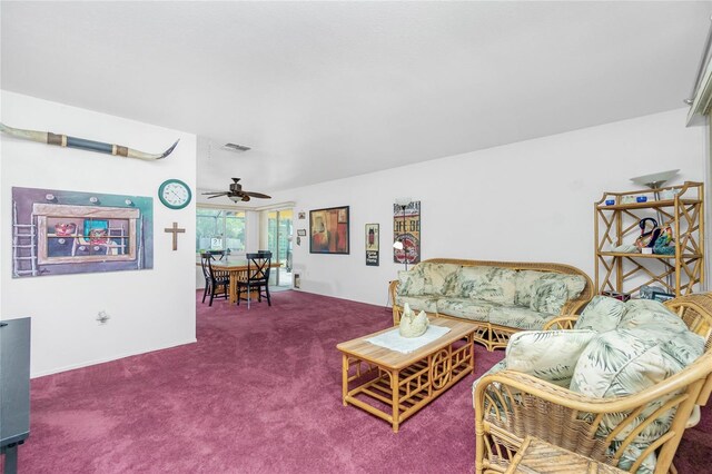 living room featuring carpet flooring and ceiling fan