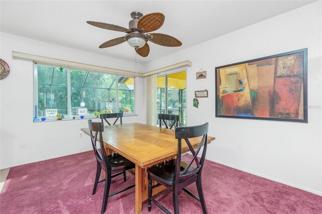 dining space with ceiling fan, plenty of natural light, and carpet