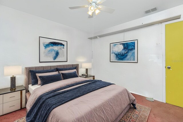 bedroom featuring ceiling fan and carpet