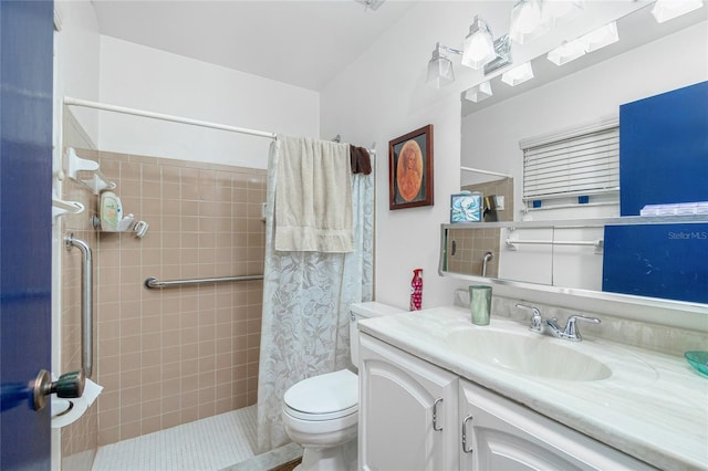 bathroom with vanity, curtained shower, and toilet