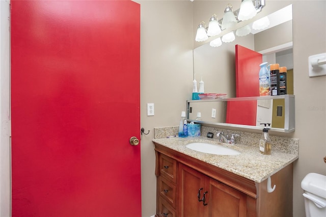 bathroom with vanity and toilet