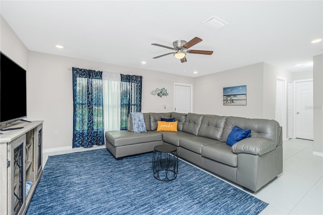 tiled living room featuring ceiling fan