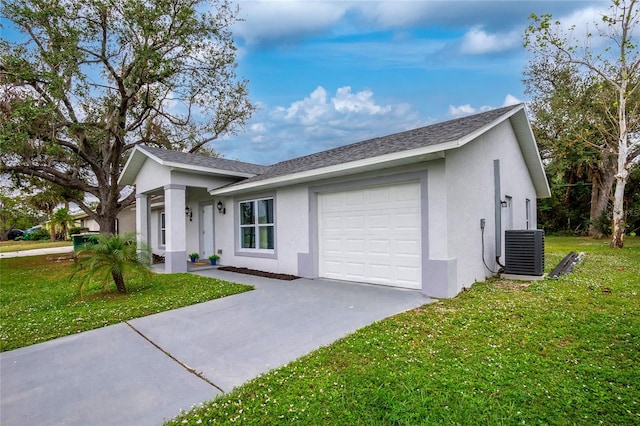 ranch-style house with a front yard, central AC unit, and a garage