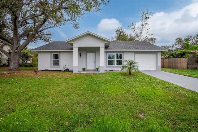 single story home with a front yard and a garage