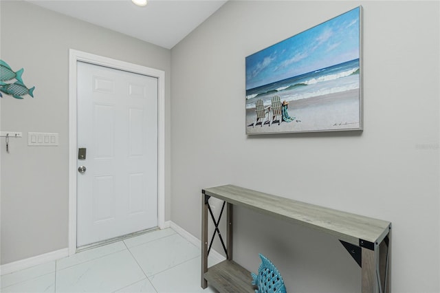 entryway featuring baseboards, recessed lighting, and light tile patterned floors
