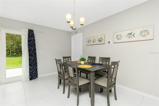 dining space featuring baseboards, a chandelier, and visible vents