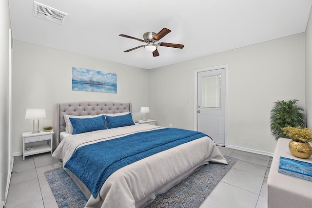 bedroom with ceiling fan, visible vents, baseboards, and tile patterned flooring