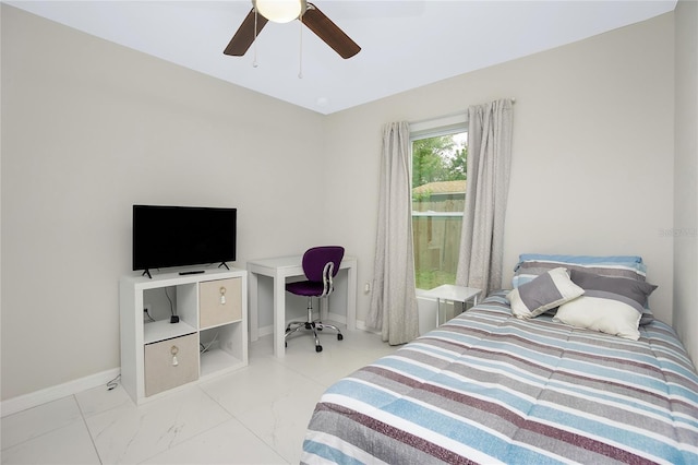 bedroom featuring baseboards, marble finish floor, and ceiling fan