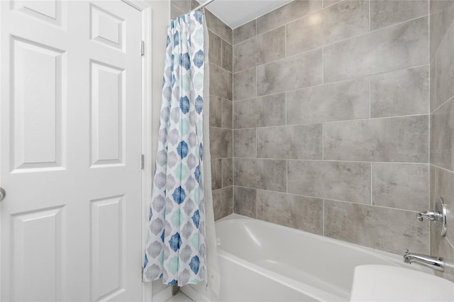 full bathroom featuring shower / tub combo with curtain and toilet