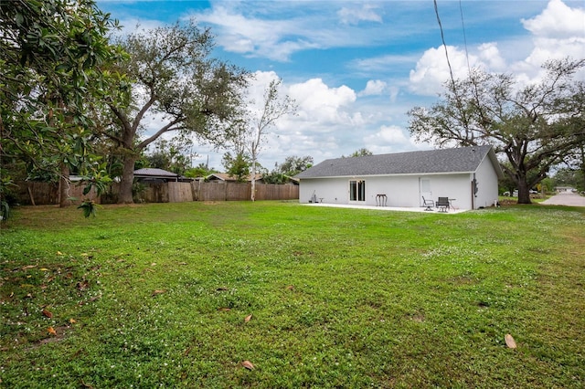 view of yard featuring a patio and fence