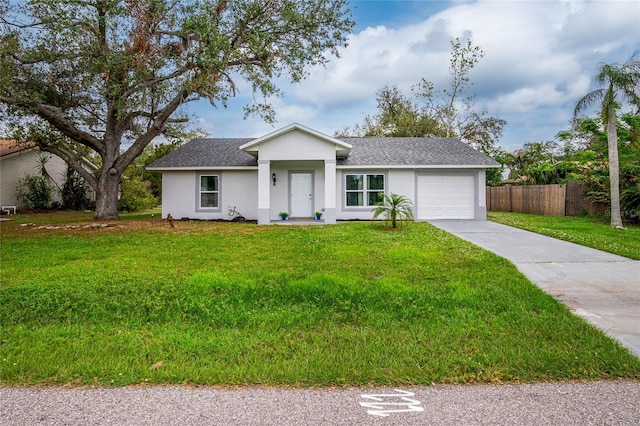 ranch-style home featuring a front yard, fence, concrete driveway, an attached garage, and stucco siding