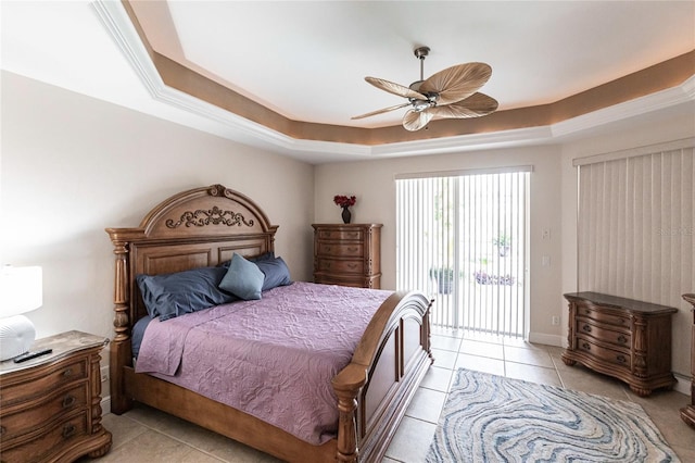 bedroom featuring access to exterior, a tray ceiling, light tile patterned floors, and ceiling fan