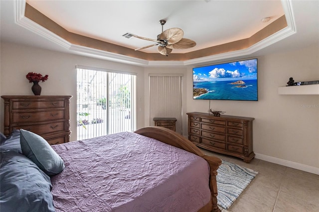 tiled bedroom with access to exterior, a tray ceiling, and ceiling fan