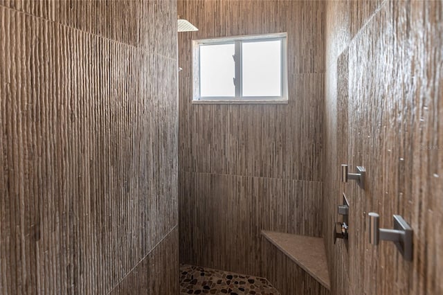 bathroom with tiled shower