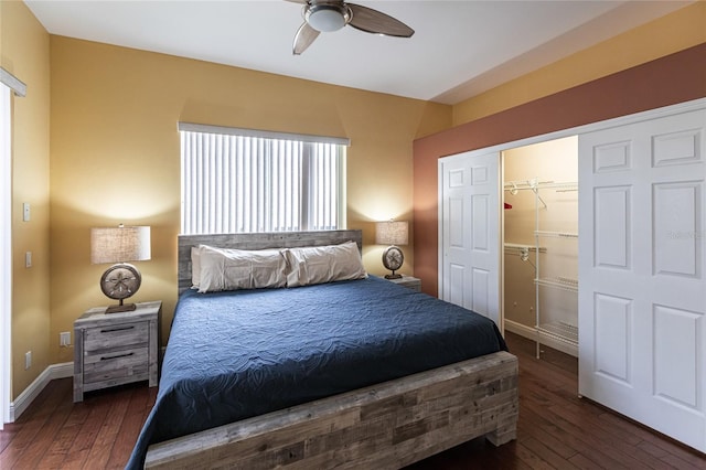 bedroom featuring dark hardwood / wood-style flooring, a spacious closet, a closet, and ceiling fan