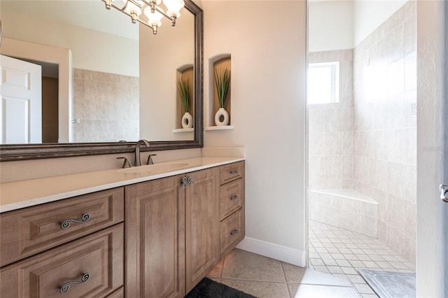 bathroom featuring walk in shower, tile patterned floors, a chandelier, and vanity